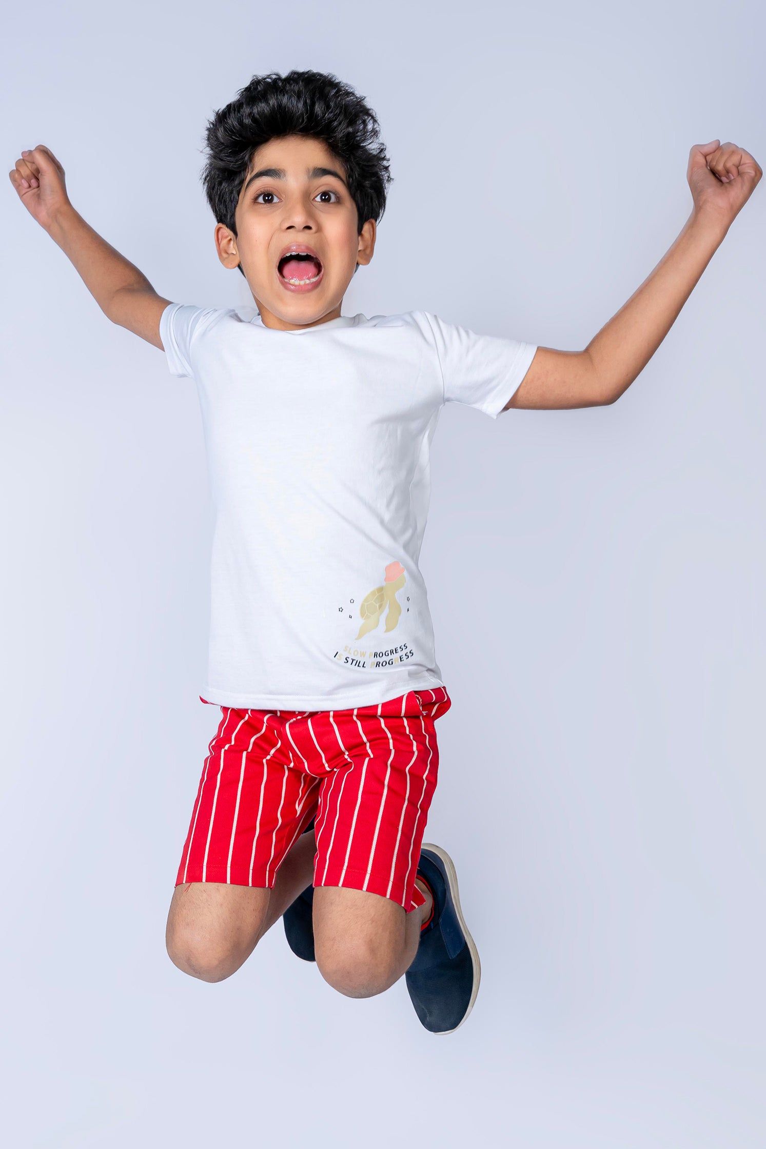 BOY'S T-SHIRT WHITE WITH "STILL PROGRESS" PRINTING