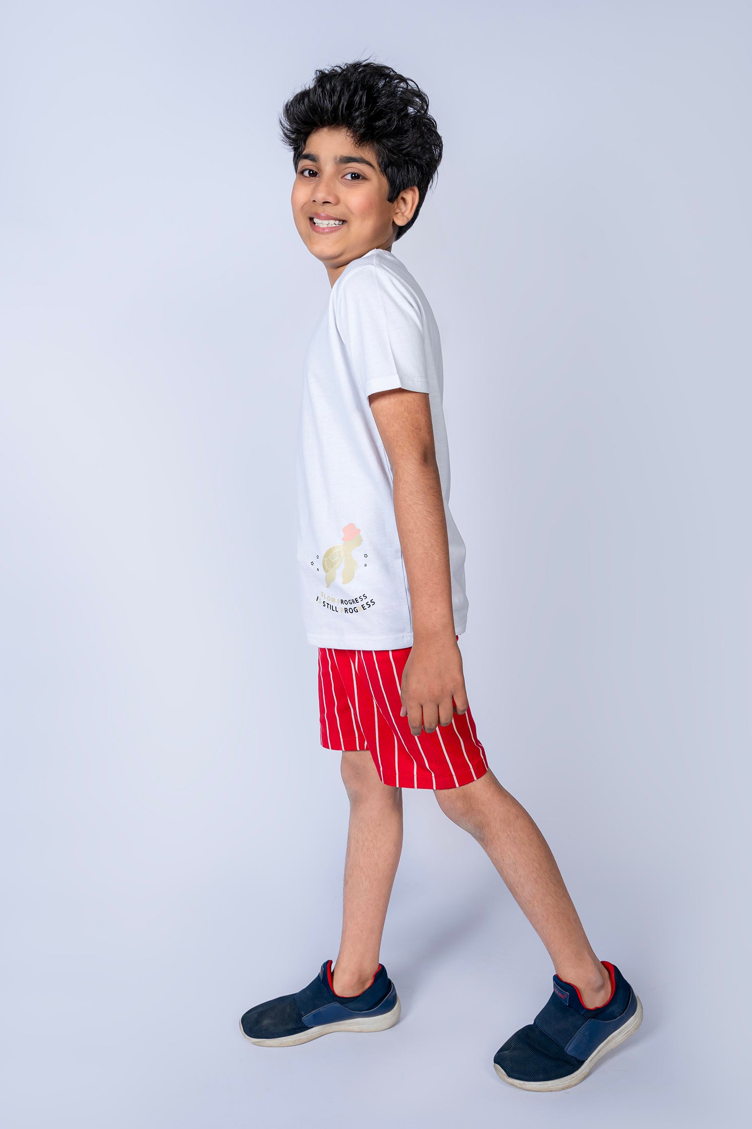 BOY'S T-SHIRT WHITE WITH "STILL PROGRESS" PRINTING