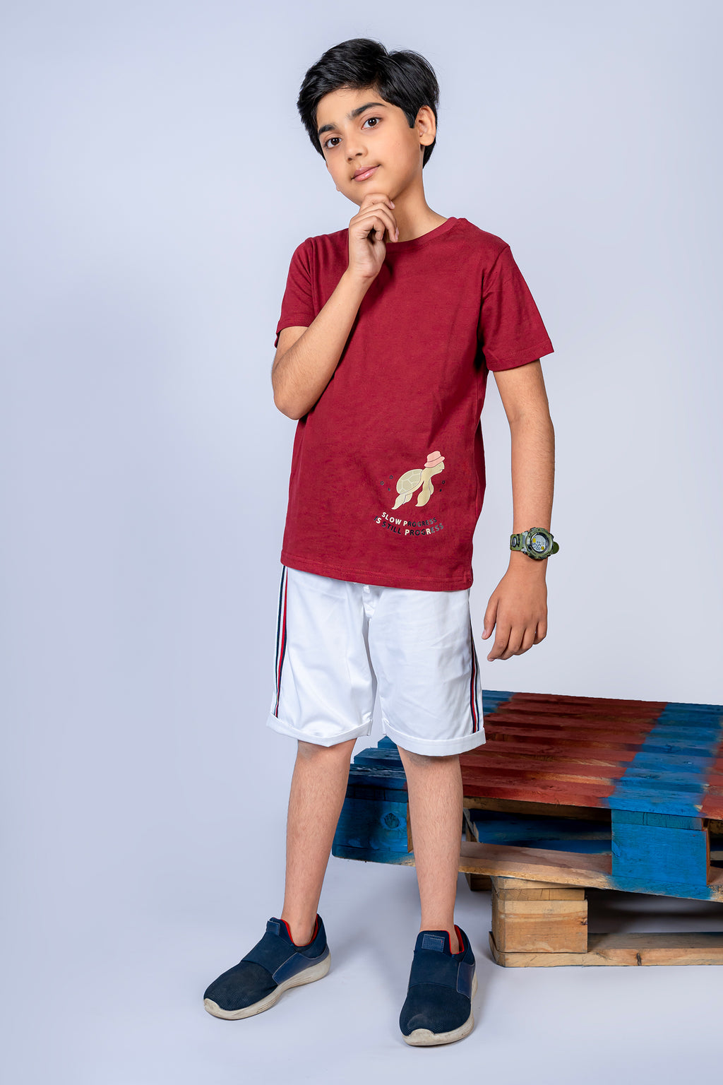 BOY'S T-SHIRT MAROON WITH "STILL PROGRESS" PRINTING