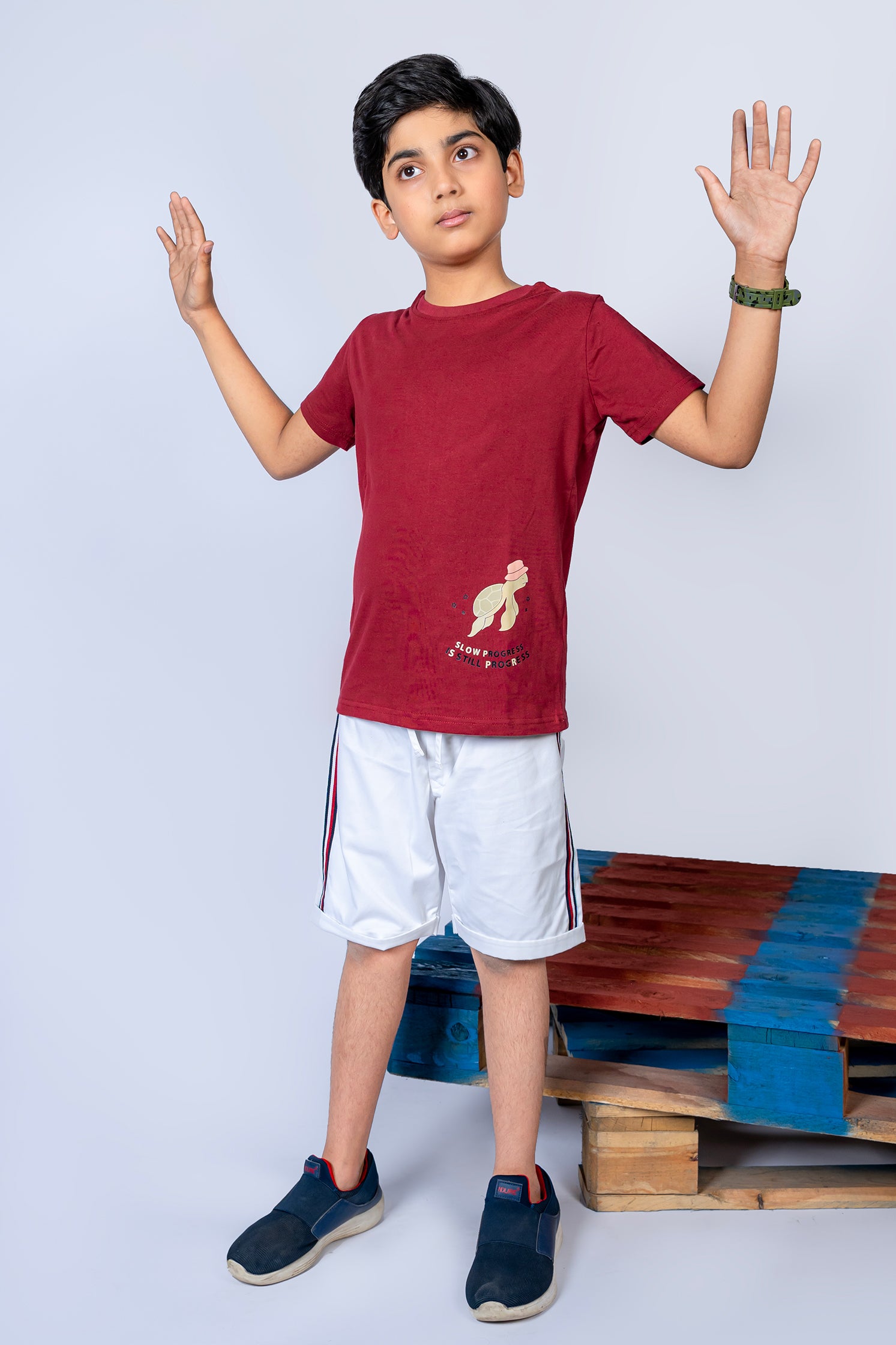 BOY'S T-SHIRT MAROON WITH "STILL PROGRESS" PRINTING