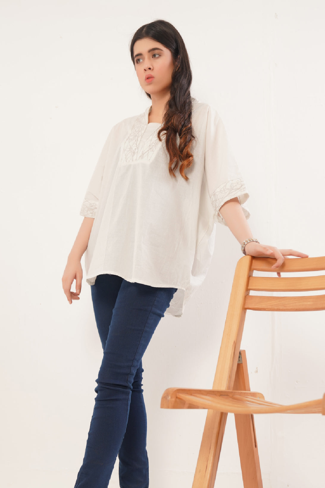 Ladies Lawn light grey loose fitted top enriched with the delicate floral embroidery